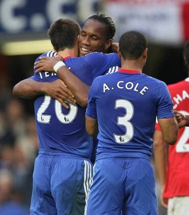 Chelseas Didier Drogba (C) celebrates with John Terry at the final whistle - Chelsea FC London - Arsenal FC London - EDITORIAL USE ONLY. No use with unauthorised audio, video, data, fixture lists, club league logos or live services. Online in-match use limited to 120 images, no video emulation. No use in betting, games or single club league player publications.