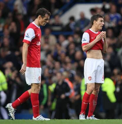 Arsenals Laurent Koscielny (R) looks on dejected at the final whistle with Sebastian Squillaci - Chelsea FC London - Arsenal FC London - EDITORIAL USE ONLY. No use with unauthorised audio, video, data, fixture lists, club league logos or live services. Online in-match use limited to 120 images, no video emulation. No use in betting, games or single club league player publications.