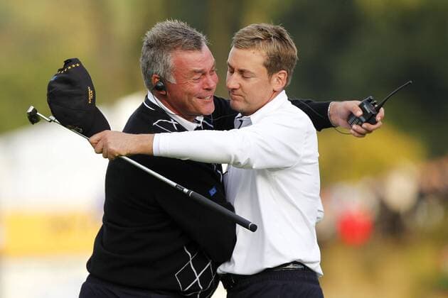 Golf - Ryder Cup 2010 - Day Three European Vice Captain Darren Clarke hugs Ian Poulter (ENG, R) after winning his match at Celtic Manor, Newport  o0 Jubel, Freude