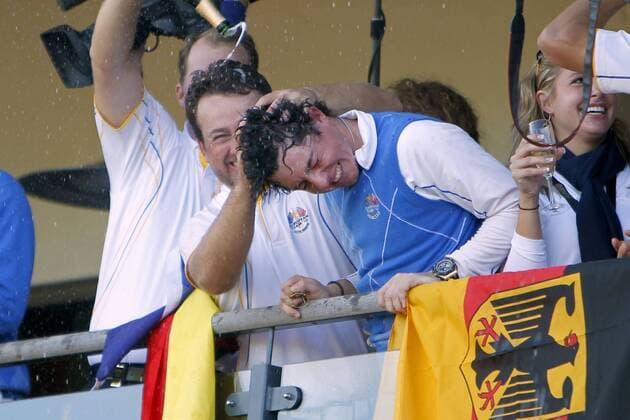 Golf - Ryder Cup 2010 - Day Four European team mates, Rory McIlroy (Northern Ireland, R) and Graeme McDowell (Northern Ireland) get soaked in champagne after winning the Ryder Cup at Celtic Manor, Newport  o0 Mc Dowell Nordirland Ilroy