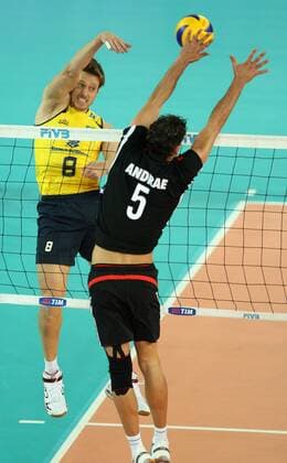 Endres Murilo Of Brazil (L) spikes the ball while Andrae Bjorn of Germany attempts to block Brazil (yellow) vs. Germany (black) xMarcoxMegax  ActionPlus11101159 Content restricted for UK based newspaper