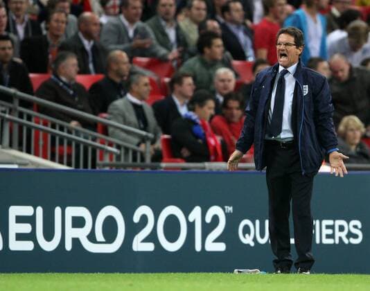 Englands coach Fabio Capello looks on dejected European Championship Qualifying Group G England v Montenegro 12th October, 2010 EDITORIAL USE ONLY. No use with unauthorised audio, video, data, fixture lists, club league logos or live services. Online in-match use limited to 120 images, no video emulation. No use in betting, games or single club league player publications. o0 Nationaltrainer