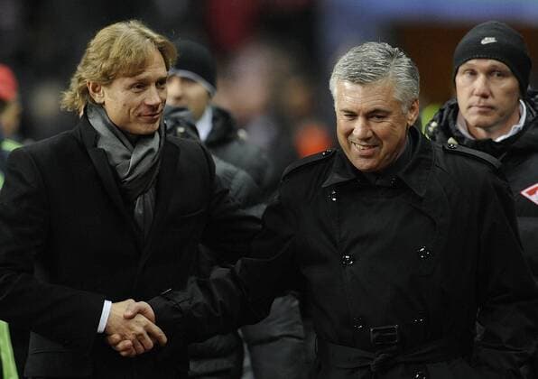 MOSCOW. OCTOBER 19, 2010. Spartak s Head Coach Valery Karpin (L) and Chelsea FC Coach Carlo Ancelotti attend their teamsâ€™ UEFA Champions League.  premiumd RE0DA254