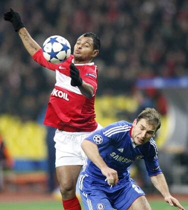MOSCOW. OCTOBER 19, 2010. Spartak s Ari (red) and FC Chelsea s Branislav Ivanovic challenge for the ball during a UEFA Champions League game Spartak Moscow vs. Chelsea FC London.  premiumd RE0DA259