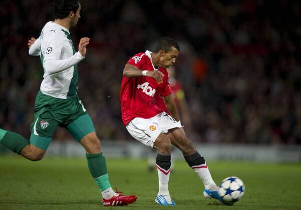 Nani (R) of Manchester United scores the first goal against Ozan Ipek (Bursaspor) - UEFA Champions League Group C - Manchester United v Bursaspor 20th October, 2010 EDITORIAL USE ONLY. No use with unauthorised audio, video, data, fixture lists, club league logos or live services. Online in-match use limited to 120 images, no video emulation. No use in betting, games or single club league player publications.