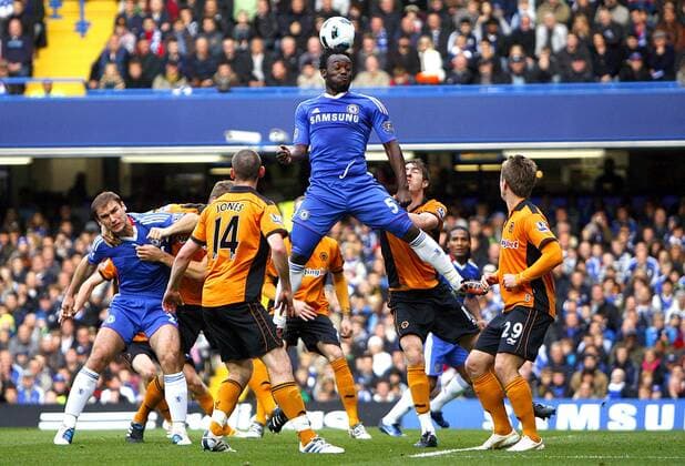 Michael Essien of Chelsea attempts to get his head to the ball - Barclays Premier League Chelsea FC (blue) v Wolverhampton Wanderers (orange) 23rd October, 2010 EDITORIAL USE ONLY. No use with unauthorised audio, video, data, fixture lists, club league logos or live services. Online in-match use limited to 120 images, no video emulation. No use in betting, games or single club league player publications.