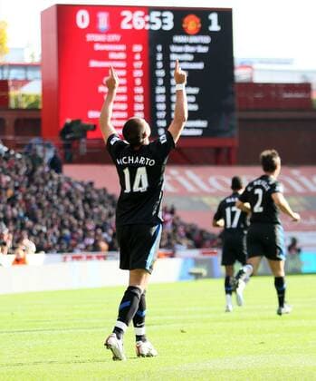 Manchester Uniteds Javier Chicharito Hernandez celebrates scoring his sides opening goal - Barclays Premier League Stoke City (red) v Manchester United ManU (black) 24th October, 2010 EDITORIAL USE ONLY. No use with unauthorised audio, video, data, fixture lists, club league logos or live services. Online in-match use limited to 120 images, no video emulation. No use in betting, games or single club league player publications.