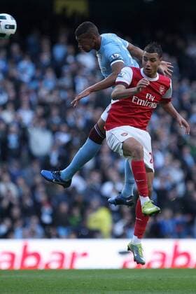 Premier League - Manchester City vs. Arsenal FC London - Jerome Boateng (L) of Manchester City wins the ball in the air over Arsenal s Marouane Chamakh at the City of Manchester Stadium 