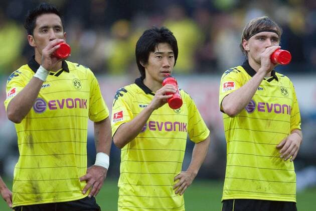 Die drei von der Tankstelle: Lucas BARRIOS li., Shinji KAGAWA mi. und Marcel SCHMELZER (alle BVB) - Borussia Dortmund (BVB) - TSG 1899 Hoffenheim 1:1