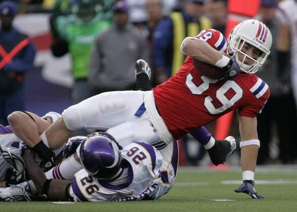 New England Patriots running back Danny Woodhead (39) is tackled by Minnesota Vikings cornerback Antoine Winfield (26) and linebacker Chad Greenway on a 7-yard reception in the first quarter at Gillette Stadium in Foxboro, Massachusetts on October 31, 2010. The Patriots defeated the Vikings 28-18.  BOS2010103116