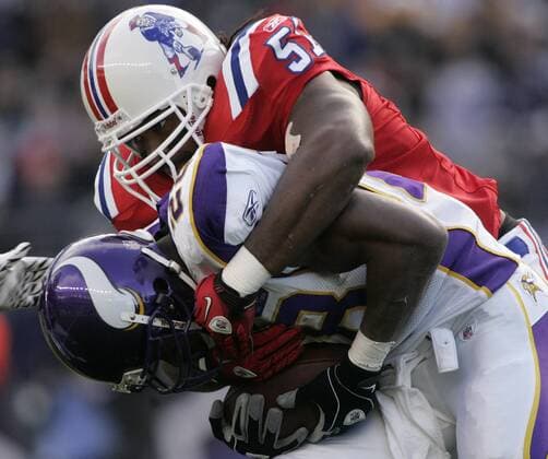 New England Patriots linebacker Jerod Mayo (52) tackles Minnesota Vikings running back Antoine Peterson (28) on a 2-yard carry by Peterson in the first quarter at Gillette Stadium in Foxboro, Massachusetts on October 31, 2010. The Patriots defeated the Vikings 28-18.  BOS2010103122
