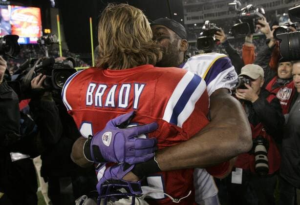 Minnesota Vikings wide receiver Randy Moss gives a hug to his former teammate, New England Patriots quarterback Tom Brady at the end of the game in Foxboro, Massachusetts  BOS2010103118