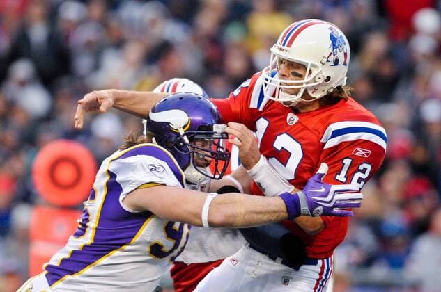 Oct. 31, 2010 - Foxborough, Massachusetts, United States of America - New England Patriots QB Tom Brady (12) is hit by Minnesota Vikings DE Brian Robison (96) after releasing the pass. The Minnesota Vikings and New England Patriots are tied up at 7 at the end of the first half at Gillette Stadium. - ZUMAq39