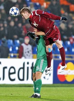 KAZAN, RUSSIA. NOVEMBER 2, 2010. Rubin s Vitaly Kaleshin and Panathinaikos Giorgos Karagounis (back) seen during an UEFA Champions League match between Rubin Kazan and Panathinaikos Athens. The match ends in a 0-0 draw.  RE0DB0FE