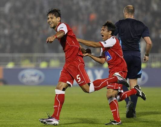 FC Braga player Moises, left and Mossoro, celebrate, during their Group H UEFA Champions League match in Belgrade, Serbia, Wednesday, Nov. 3, 2010. PARTIZAN BELGRAD vs SC Sporting Braga.  PARTIZAN-BRAGA_01