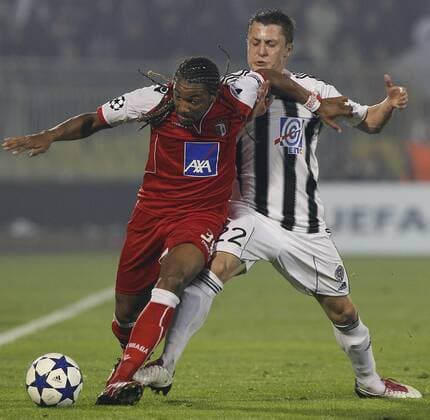 FC Braga player Alan, left is challenged by Partizan player Sasa Ilic, right, during their Group H UEFA Champions League match in Belgrade, Serbia, Wednesday, Nov. 3, 2010. PARTIZAN BELGRAD vs SC Sporting Braga.  PARTIZAN-BRAGA_12