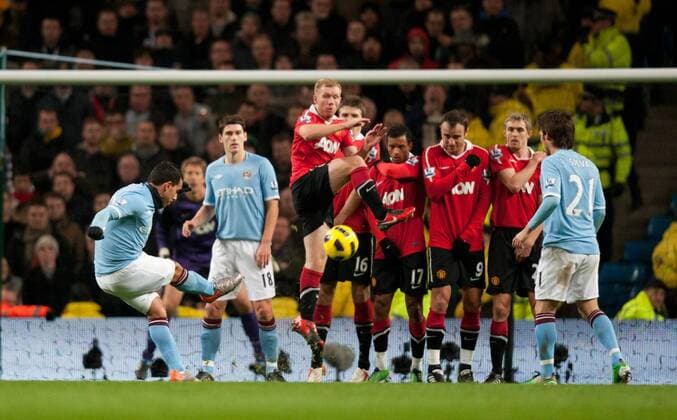 Carlos Tevez of Manchester City takes a free kick - Premier League Manchester City v Manchester United (Red) 10th November, 2010 EDITORIAL USE ONLY. No use with unauthorised audio, video, data, fixture lists, club league logos or live services. Online in-match use limited to 120 images, no video emulation. No use in betting, games or single club league player publications. o0 manu