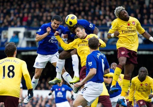 Louis Saha 3.l. of Everton FC gets his head to ball as Cesc Fabregas 3.r. of Arsenal FC London covers Barclays Premier League Everton v Arsenal 14th November, 2010 EDITORIAL USE ONLY. No use with unauthorised audio, video, data, fixture lists, club league logos or live services. Online in-match use limited to 120 images, no video emulation. No use in betting, games or single club league player publications.