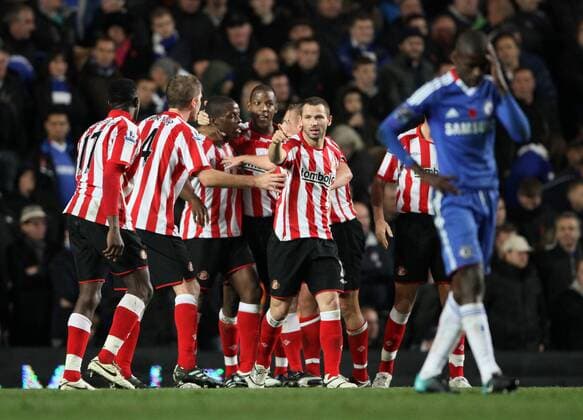 Sunderlands Nedum Onuoha (C) celebrates scoring his sides opening goal --- Barclays Premier League - FC Chelsea London (blue) vs FC Sunderland (red stripes), 14th November, 2010 EDITORIAL USE ONLY. No use with unauthorised audio, video, data, fixture lists, club league logos or live services. Online in-match use limited to 120 images, no video emulation. No use in betting, games or single club league player publications. o0 Jubel Freude