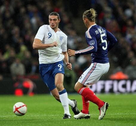 Englands Andy Carroll tussles with Frances Philippe Mexes International Friendly England (white) v France (blue) 17th November, 2010 EDITORIAL USE ONLY. No use with unauthorised audio, video, data, fixture lists, club league logos or live services. Online in-match use limited to 120 images, no video emulation. No use in betting, games or single club league player publications.