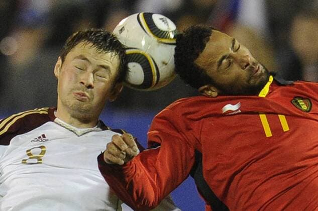 VORONEZH, NOVEMBER 17, 2010. Russia s Diniar Bilyaletdinov and Belgium s Moussa Dembelo (R) seen during the international friendly match between Russia and Belgium at Central Stadium. Belgians won the match 0-2.  RE0DC120