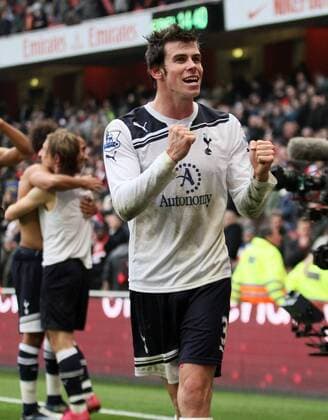 Tottenhams Gareth Bale celebrates at the final whistle --- Barclays Premier League, Arsenal (red) v Tottenham Hotspur (white) 20th November, 2010 EDITORIAL USE ONLY. No use with unauthorised audio, video, data, fixture lists, club league logos or live services. Online in-match use limited to 120 images, no video emulation. No use in betting, games or single club league player publications.