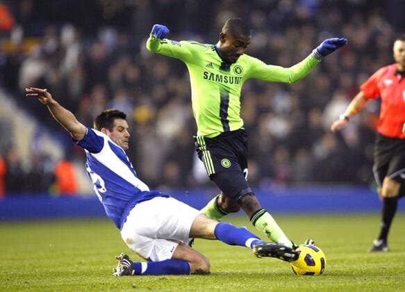 Scott Dann of Birmingham City tackles Salomon Kalou of FC Chelsea (green) Barclays Premier League Birmingham City v FC Chelsea (green) 20th November, 2010 EDITORIAL USE ONLY. No use with unauthorised audio, video, data, fixture lists, club league logos or live services. Online in-match use limited to 120 images, no video emulation. No use in betting, games or single club league player publications.