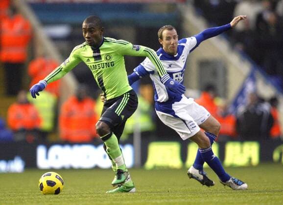 Salomon Kalou of FC Chelsea (green) gets past Lee Bowyer of Birmingham City Barclays Premier League Birmingham City v FC Chelsea (green) 20th November, 2010 EDITORIAL USE ONLY. No use with unauthorised audio, video, data, fixture lists, club league logos or live services. Online in-match use limited to 120 images, no video emulation. No use in betting, games or single club league player publications.