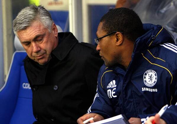 Coach Carlo Ancelotti of FC Chelsea (L) new assistant Michael Emenalo looks on Barclays Premier League Birmingham City v FC Chelsea (green) 20th November, 2010 EDITORIAL USE ONLY. No use with unauthorised audio, video, data, fixture lists, club league logos or live services. Online in-match use limited to 120 images, no video emulation. No use in betting, games or single club league player publications.
