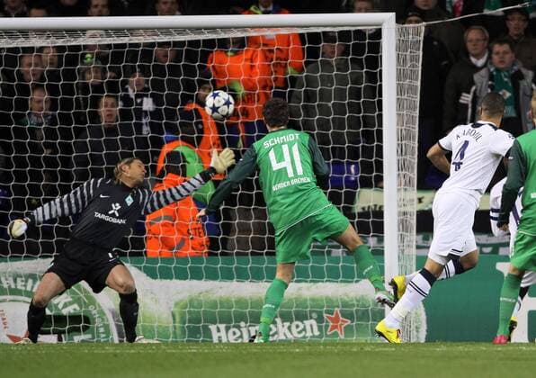 Tottenhams Younes Kaboul (R) scoring his sides opening goal - Champions League, Tottenham Hotspur (white) vs. Werder Bremen (green), 24th November, 2010 EDITORIAL USE ONLY. No use with unauthorised audio, video, data, fixture lists, club league logos or live services. Online in-match use limited to 120 images, no video emulation. No use in betting, games or single club league player publications. o0 Tor