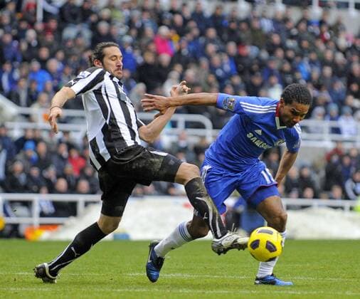 Newcastle United s Jonas Gutierrez (L) and Chelsea s Florent Malouda. Barclays Premier League, Newcastle United v Chelsea FC London, 28th November, 2010 EDITORIAL USE ONLY. No use with unauthorised audio, video, data, fixture lists, club league logos or live services. Online in-match use limited to 120 images, no video emulation. No use in betting, games or single club league player publications.