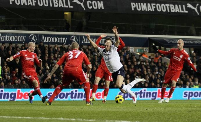 Tottenhams Alan Hutton (C) goes down but no penalty is given - Barclays Premier League Tottenham Hotspur (white) v Liverpool FC (red) 28th November, 2010 EDITORIAL USE ONLY. No use with unauthorised audio, video, data, fixture lists, club league logos or live services. Online in-match use limited to 120 images, no video emulation. No use in betting, games or single club league player publications.