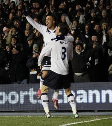 Tottenhams Aaron Lennon (L) celebrates scoring his sides second goal - Barclays Premier League Tottenham Hotspur (white) v Liverpool FC (red) 28th November, 2010 EDITORIAL USE ONLY. No use with unauthorised audio, video, data, fixture lists, club league logos or live services. Online in-match use limited to 120 images, no video emulation. No use in betting, games or single club league player publications.
