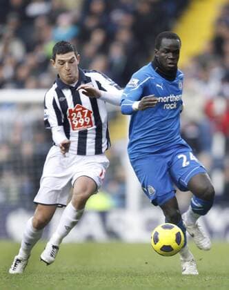 Graham Dorrans of West Bromwich Albion competes with Cheik Tiote - West Bromwich Albion (white) vs. Newcastle United (blue) EDITORIAL USE ONLY. No use with unauthorised audio, video, data, fixture lists, club league logos or live services. Online in-match use limited to 120 images, no video emulation. No use in betting, games or single club league player publications.
