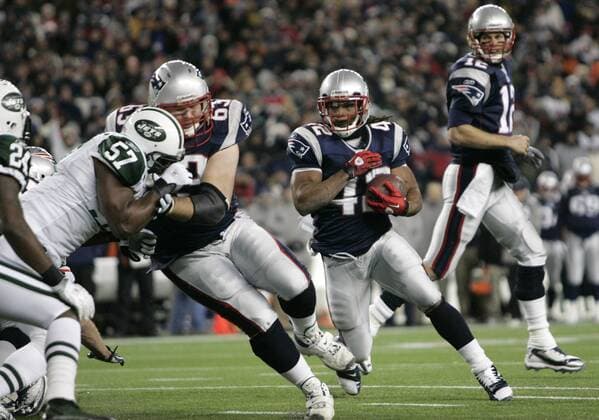 New England Patriots running back BenJarvus Green-Ellis charges into the end zone on a one yard touchdown past Patriots offensive lineman Dan Connolly (63) blocking New York Jets linebacker Bart Scott (57) in the first quarter at Gillette Stadium in Foxboro, Massachusetts on December 6, 2010. Patriots quarterback Tom Brady watches the play from the back field.  BOS2010120604