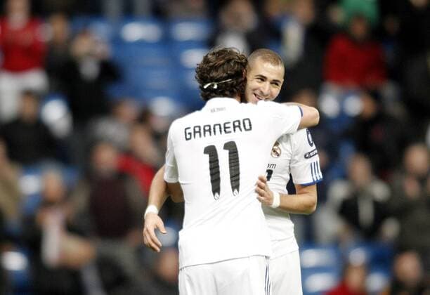 Real Madrid s Karim Benzema celebrates with Esteban Granero - Real Madrid CF (white) vs AJ Auxerre -  (201012087183)