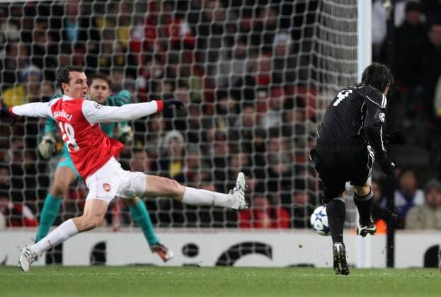 Belgrades Cleo (R) scoring his sides equaliser - Champions League: Arsenal FC (red) v Partizan Belgrade 8th December, 2010 - EDITORIAL USE ONLY. No use with unauthorised audio, video, data, fixture lists, club league logos or live services. Online in-match use limited to 120 images, no video emulation. No use in betting, games or single club league player publications.