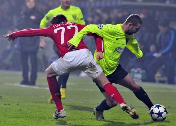 Zilina s Emil Rilke, right, and Kirill Kombarov of Spartak Moscow fight for ball during their Champions League Group F - MSK Zilina vs. Spartak Moscow 1:2. (CTKxPhoto JaroslavxPodhorsky)  CTKPhoto13201012081074301