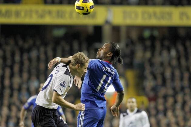 Tottenham Hotspur (white) vs. Chelsea FC (blue) - Chelsea s Didier Drogba and Tottenham Hotspur s Michael Dawson fight for a header 