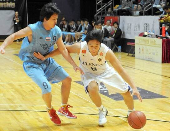 HONG KONG, Dec. 14, 2010 - Philippines Austria Raymond (R) controls the ball during the match against Thailand at the 18th Kung Sheung Cup International Basketball Invitation Championship in HongKong -