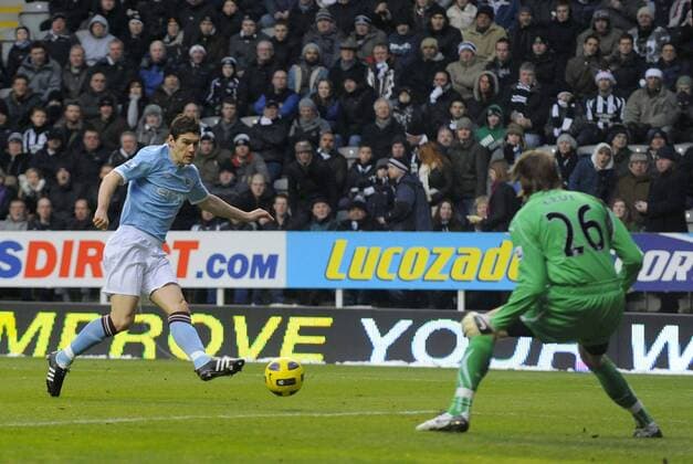 Manchester City s Gareth Barry scores his side s first goa against goalkeeper Tim Krul of Newcastlel. Barclays Premier League Newcastle United v Manchester City 26th December, 2010 EDITORIAL USE ONLY. No use with unauthorised audio, video, data, fixture lists, club league logos or live services. Online in-match use limited to 120 images, no video emulation. No use in betting, games or single club league player publications. o0 Newcastle Tor