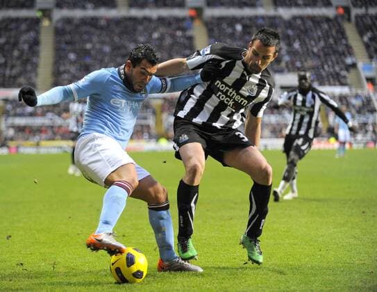Newcastle s Jose Enrique (R) and Manchester City s Carlos Tevez. Barclays Premier League Newcastle United v Manchester City 26th December, 2010 EDITORIAL USE ONLY. No use with unauthorised audio, video, data, fixture lists, club league logos or live services. Online in-match use limited to 120 images, no video emulation. No use in betting, games or single club league player publications.
