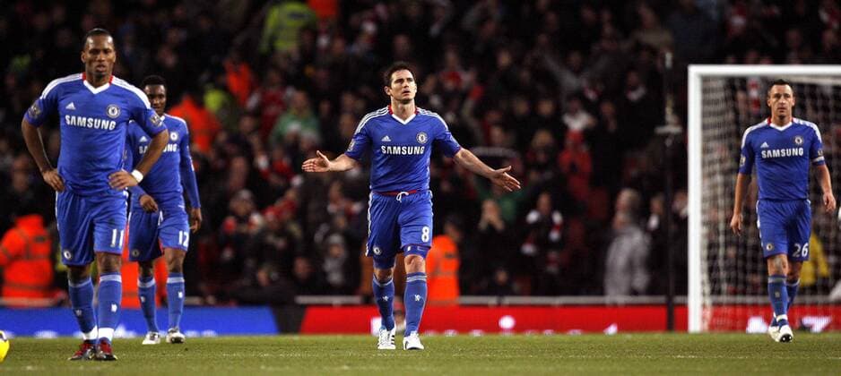 Dejection for Frank Lampard (C) and Chelsea after Arsenal scored their first goal - Barclays Premier League, Arsenal FC (red) v Chelsea 27th December, 2010 EDITORIAL USE ONLY. No use with unauthorised audio, video, data, fixture lists, club league logos or live services. Online in-match use limited to 120 images, no video emulation. No use in betting, games or single club league player publications.
