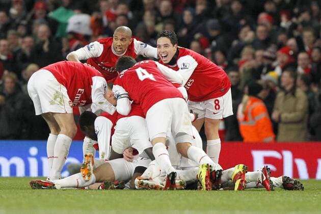 Football - Premiership - Arsenal FC (red) vs. Chelsea (blue): Arsenal celebrate with Samir Nasri (R) and Gael Clichy (C, back) a goal at The Emirates Stadium, London 