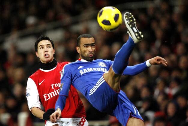 Jose Bosingwa of Chelsea FC holds off Samir Nasri of Arsenal - Barclays Premier League, Arsenal (red) v Chelsea FC 27th December, 2010 EDITORIAL USE ONLY. No use with unauthorised audio, video, data, fixture lists, club league logos or live services. Online in-match use limited to 120 images, no video emulation. No use in betting, games or single club league player publications.
