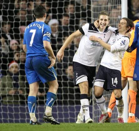Tottenhams Michael Dawson (C) celebrates at the final whistle with Luka Modric in front of Newcastles Joey Barton Barclays Premier League Tottenham Hotspur (white) vs Newcastle United (blue) 28th December, 2010 EDITORIAL USE ONLY. No use with unauthorised audio, video, data, fixture lists, club league logos or live services. Online in-match use limited to 120 images, no video emulation. No use in betting, games or single club league player publications. o0 Jubel Freude