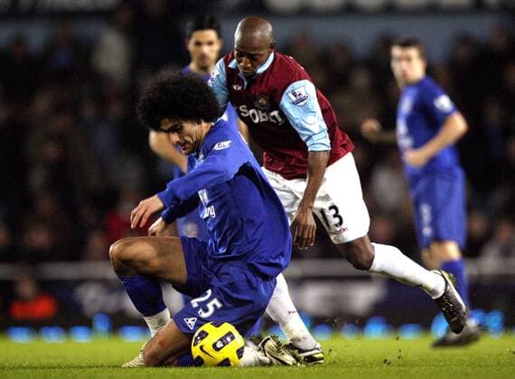 Marouane Fellaini (L) of Everton holds off Luis Boa Morte of West Ham United Barclays Premier League: West Ham United vs Everton FC. 28th December, 2010 EDITORIAL USE ONLY. No use with unauthorised audio, video, data, fixture lists, club league logos or live services. Online in-match use limited to 120 images, no video emulation. No use in betting, games or single club league player publications.