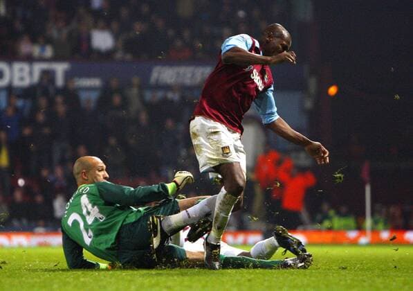 Tim Howard (L) of Everton rushes out of his penalty area and tackles Luis Boa Morte of West Ham United Barclays Premier League: West Ham United vs Everton FC. 28th December, 2010 EDITORIAL USE ONLY. No use with unauthorised audio, video, data, fixture lists, club league logos or live services. Online in-match use limited to 120 images, no video emulation. No use in betting, games or single club league player publications.