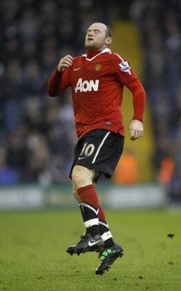 Wayne Rooney reacts to an injury late in the second half. - Barclays Premier League, West Bromwich Albion (white) vs. Manchester United (red) 1st January, 2011 EDITORIAL USE ONLY. No use with unauthorised audio, video, data, fixture lists, club league logos or live services. Online in-match use limited to 120 images, no video emulation. No use in betting, games or single club league player publications. o0 Manu Verletzung,