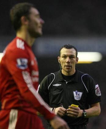 FC Liverpool (red) vs. Bolton Wanderers (white): Referee Kevin Friend books Fabio Aurelio of Liverpool at Anfield 